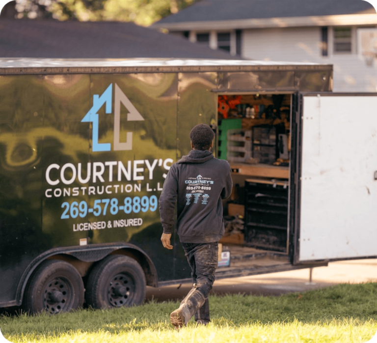 Courtney's construction truck and worker